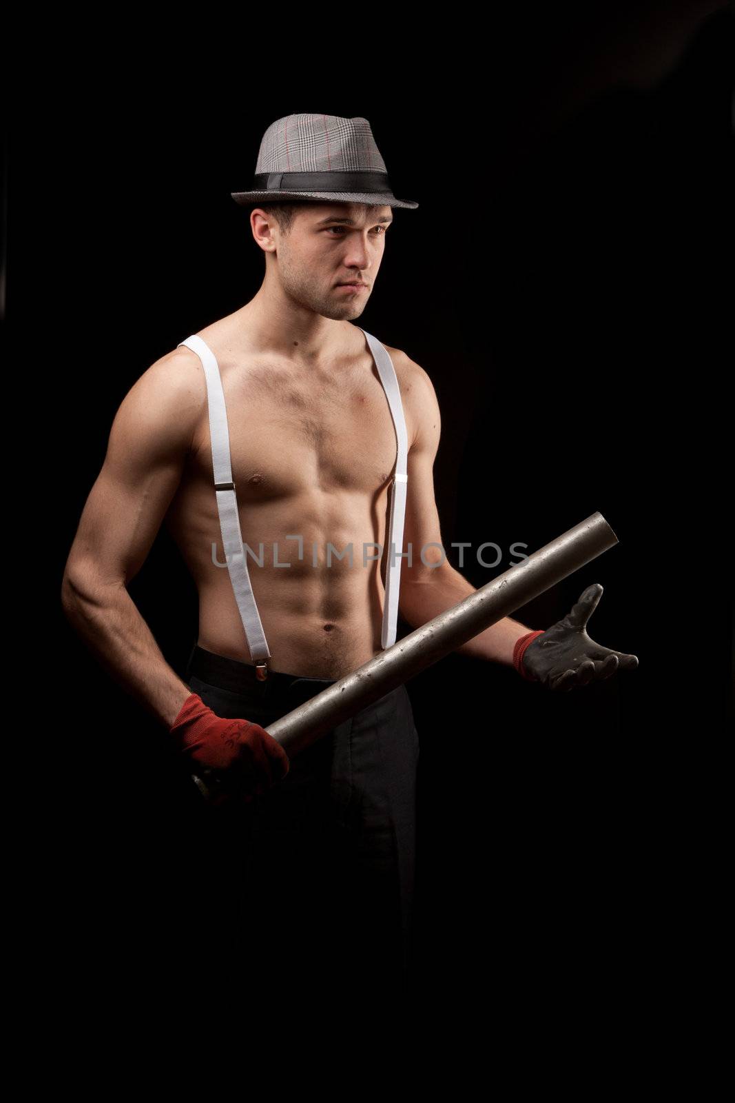 men in the hat on with suspenders over black