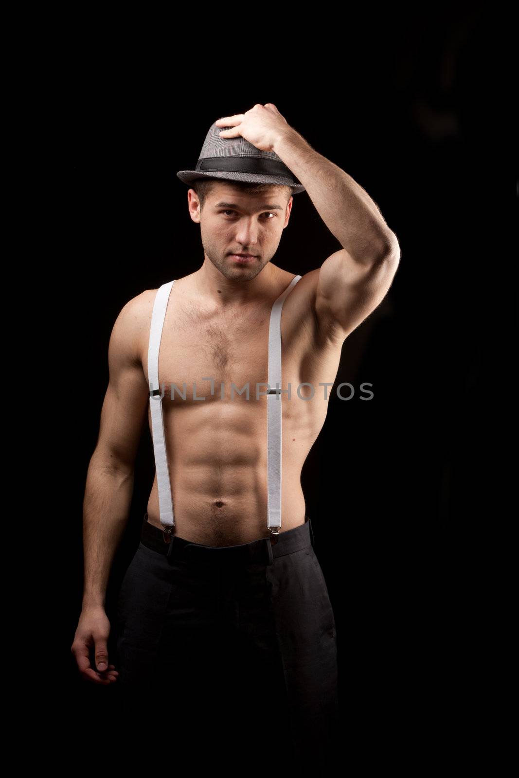 men in the hat on with suspenders over black