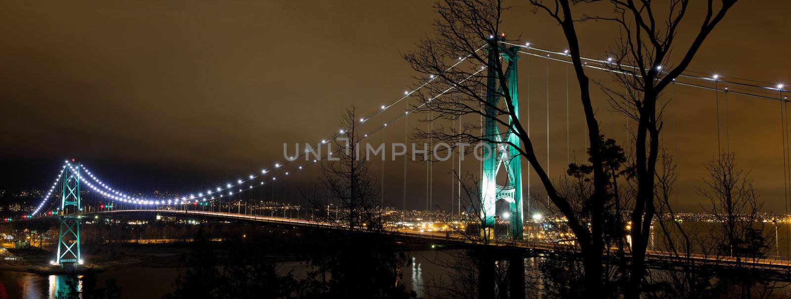 Lions Gate Bridge Over Burrard inlet in Vancouver Bc Canada at night Panorama