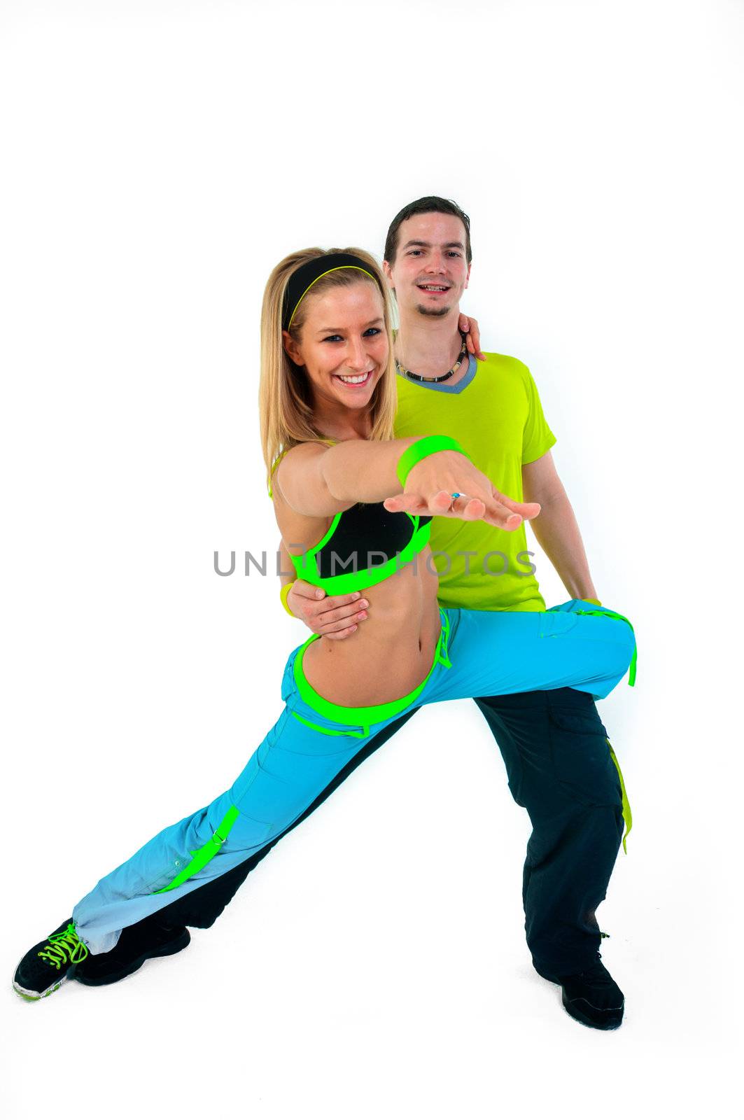 Acrobatic dancing with two young trainers on white background