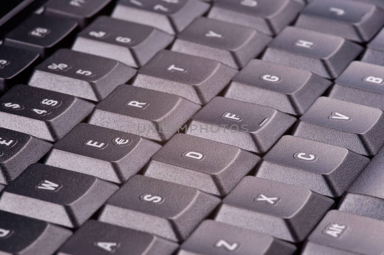 Closeup of a black computer keyboard. Diagonal shot.