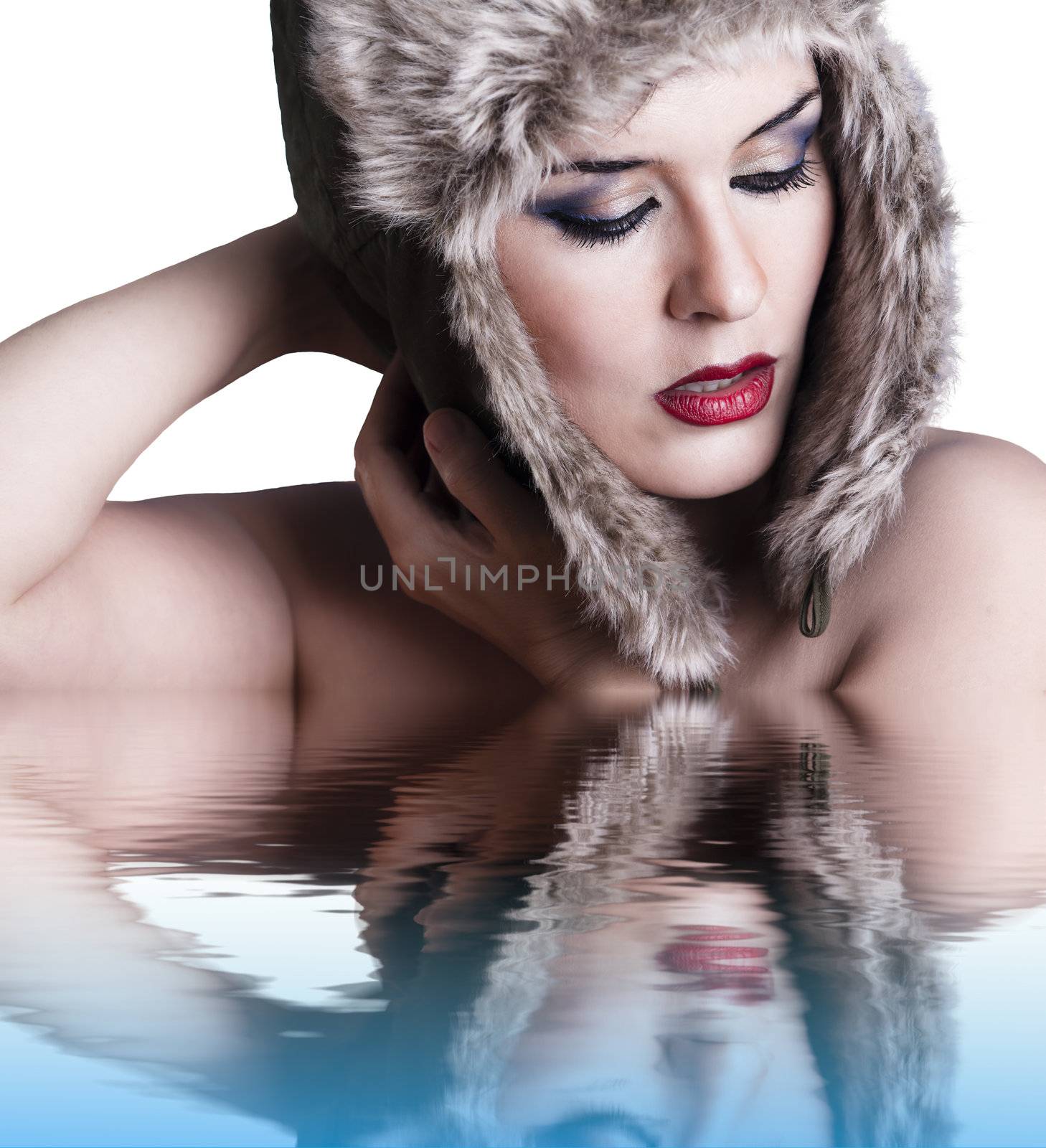 Sexy winter woman with reflection in water, on white background. by FernandoCortes