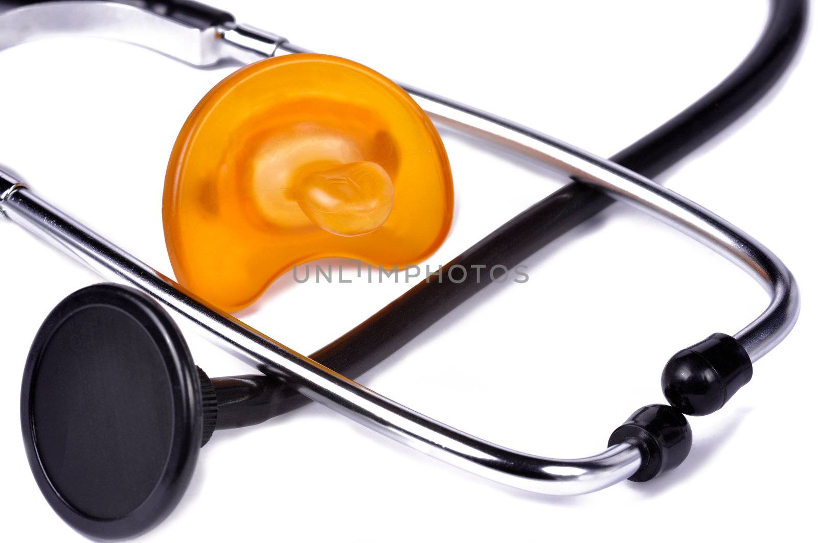 Pacifier and stethoscope. Conceptual image to ilustrate Pediatrics and baby health.