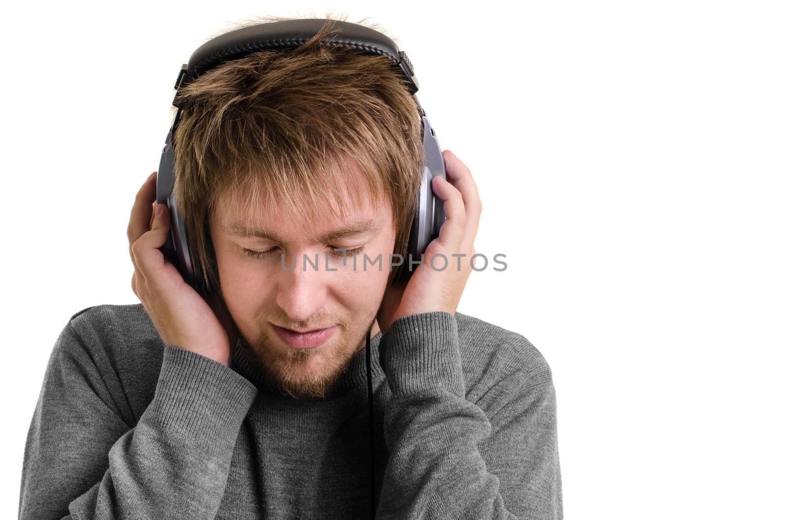 Young man with headphones against white background