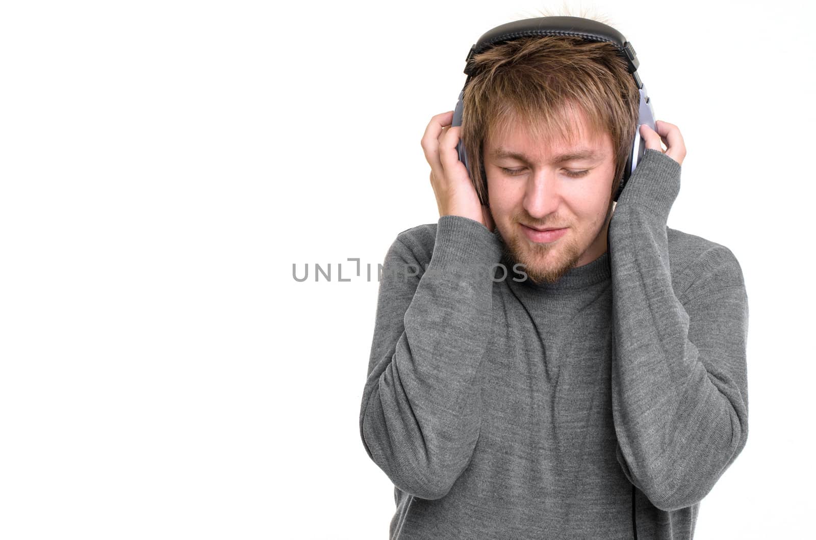 Young man with headphones against white background