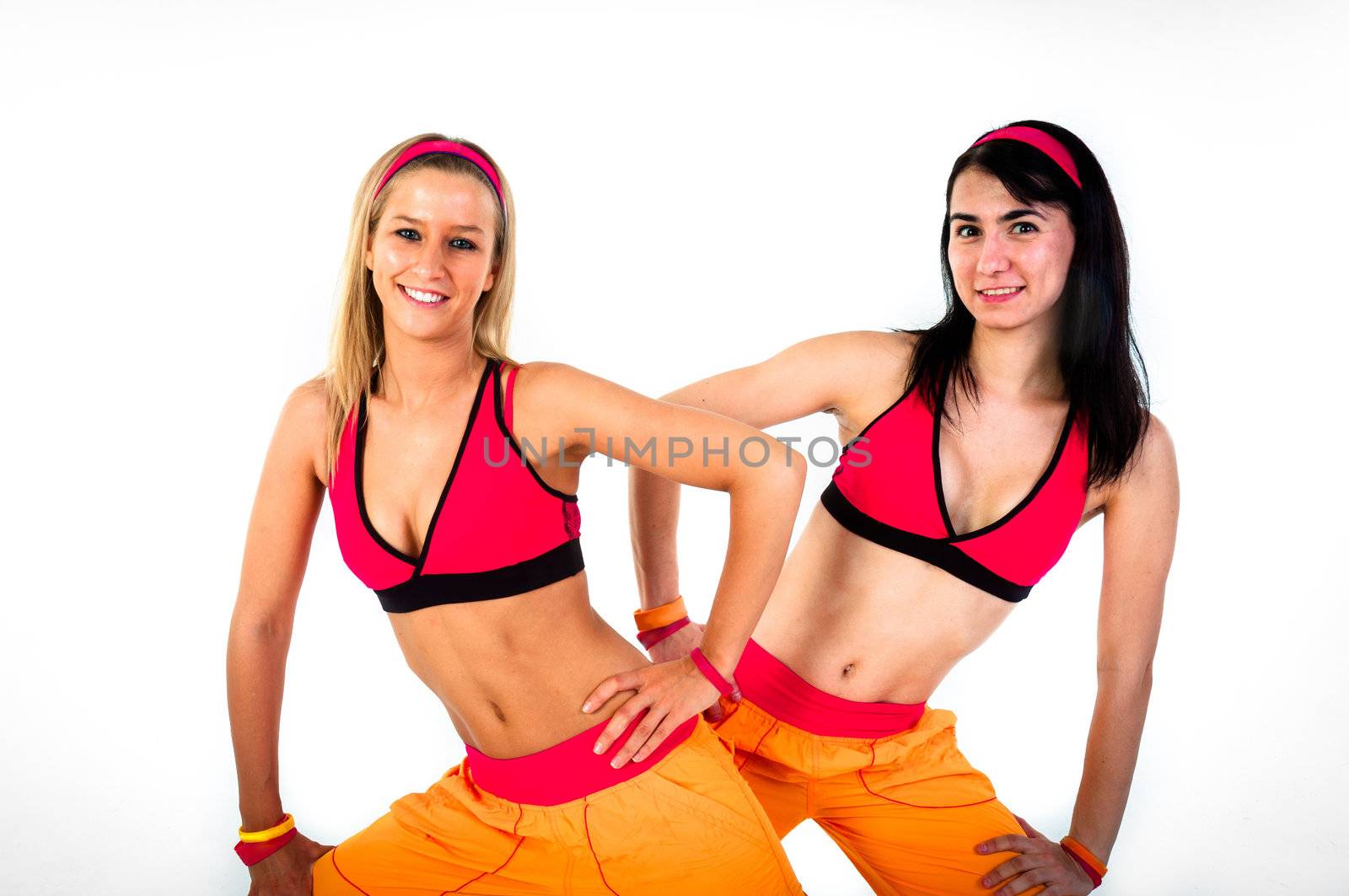 Young fitness instructor girls on isolated white background