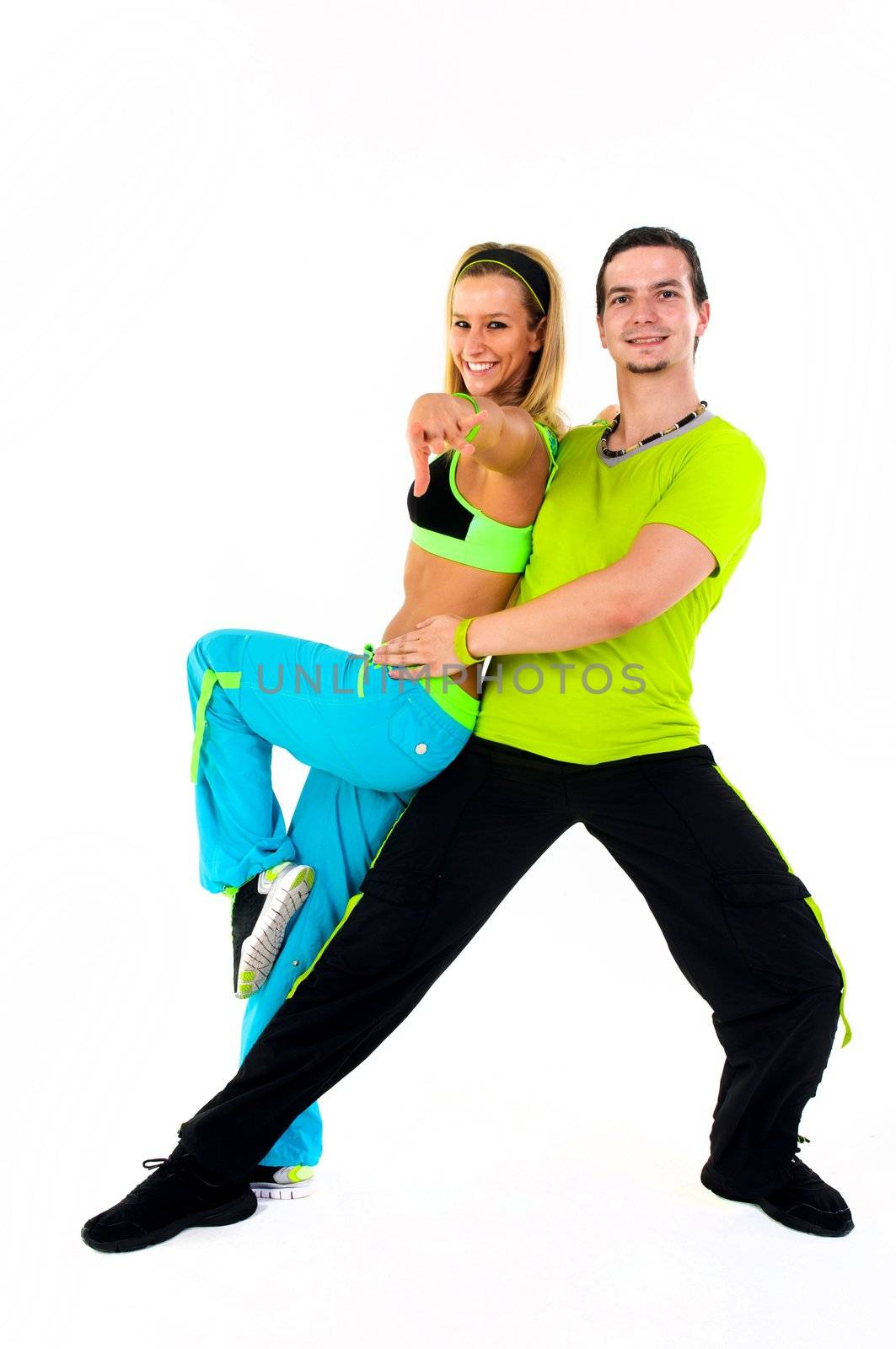 Acrobatic dancing with two young trainers on white background