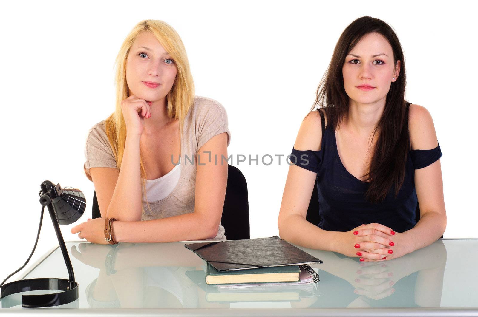 Two beautiful student girls getting ready for school isolated