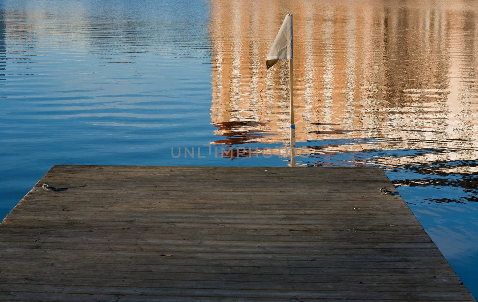 Small dock and a flag attached to it.