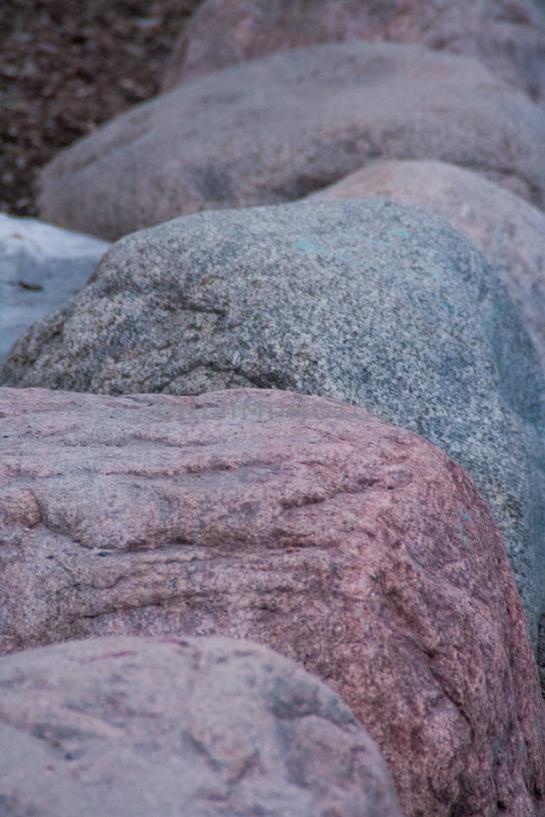 Row of a coloured rocks. Each one is different.