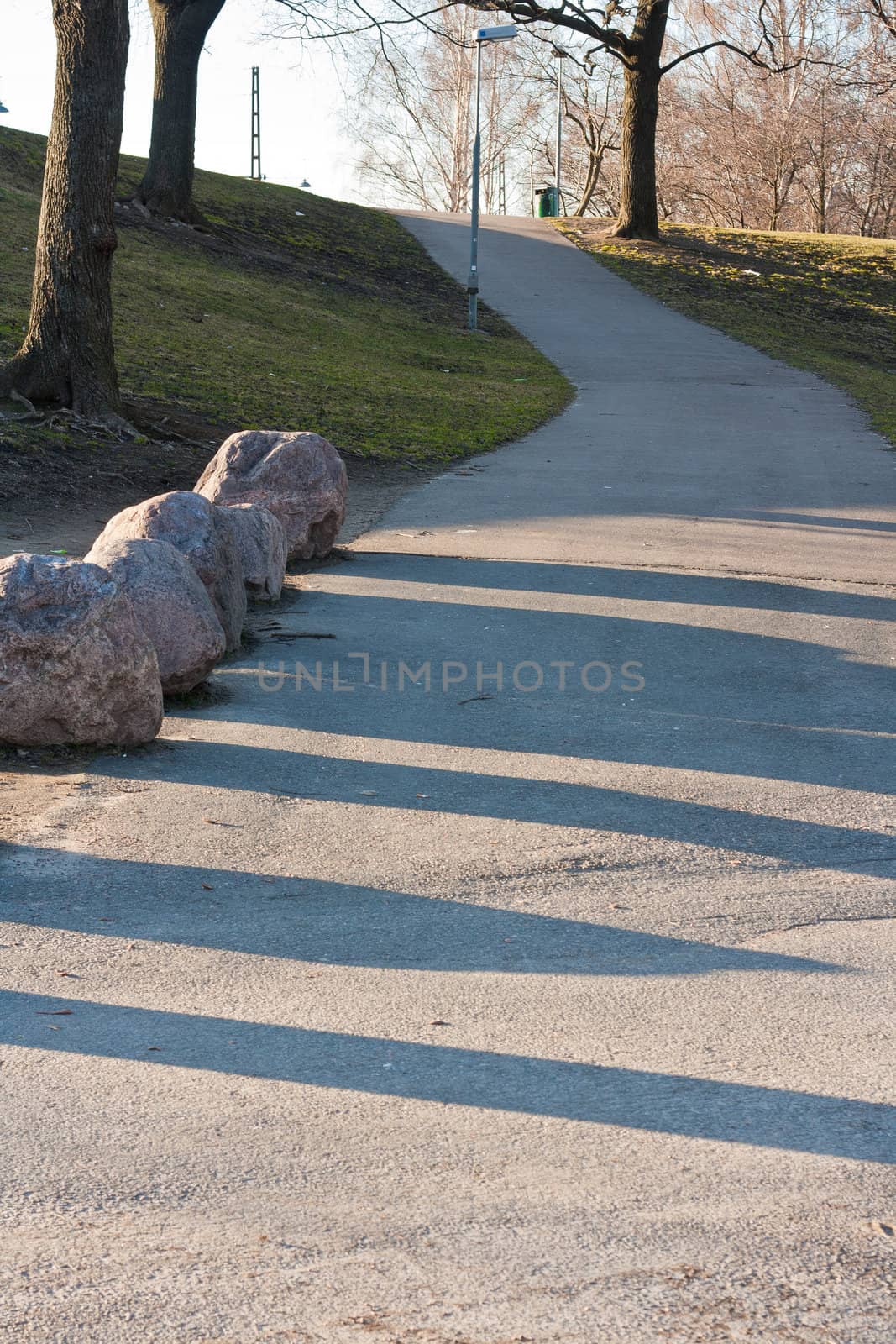 Road leading to a hill in spring time Finland.