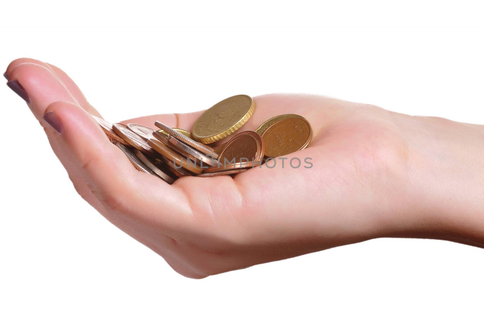 Hand holding a pile of coins isolated in a white background