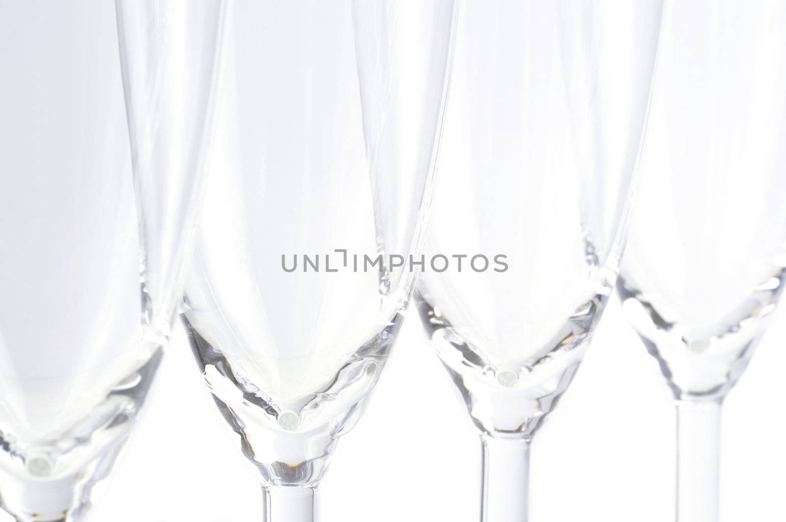 Champagne glasses in a white background