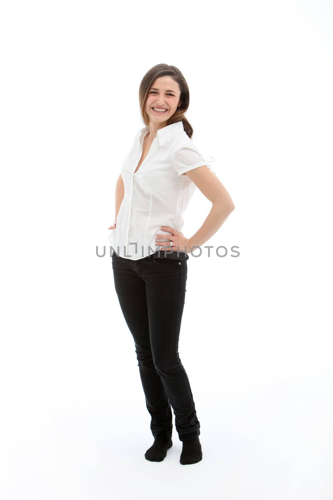 Standing smiling brunette female isolated on white