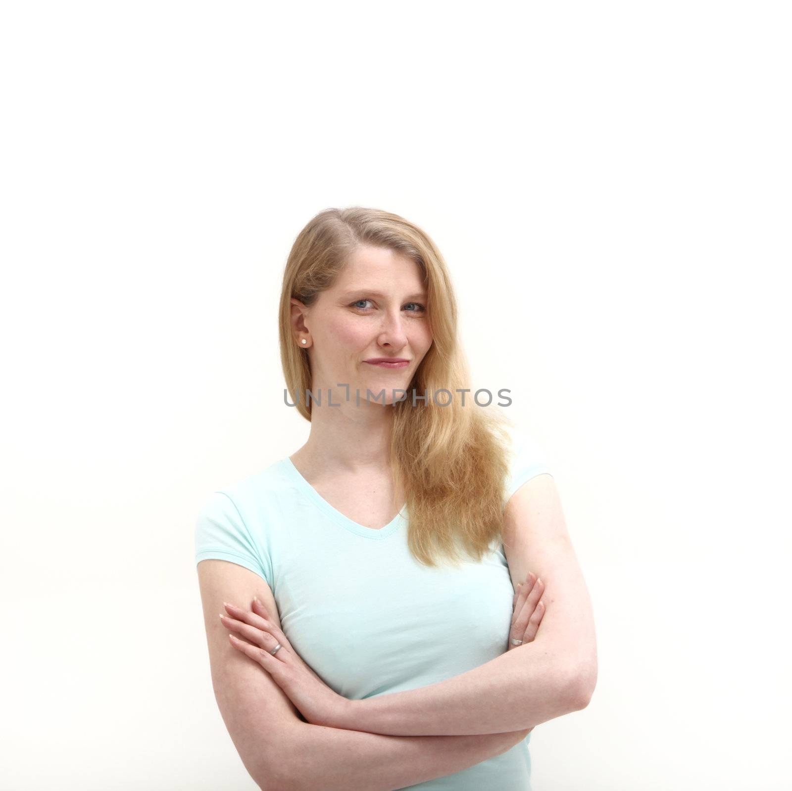 Studio shot of confident blonde woman on white background