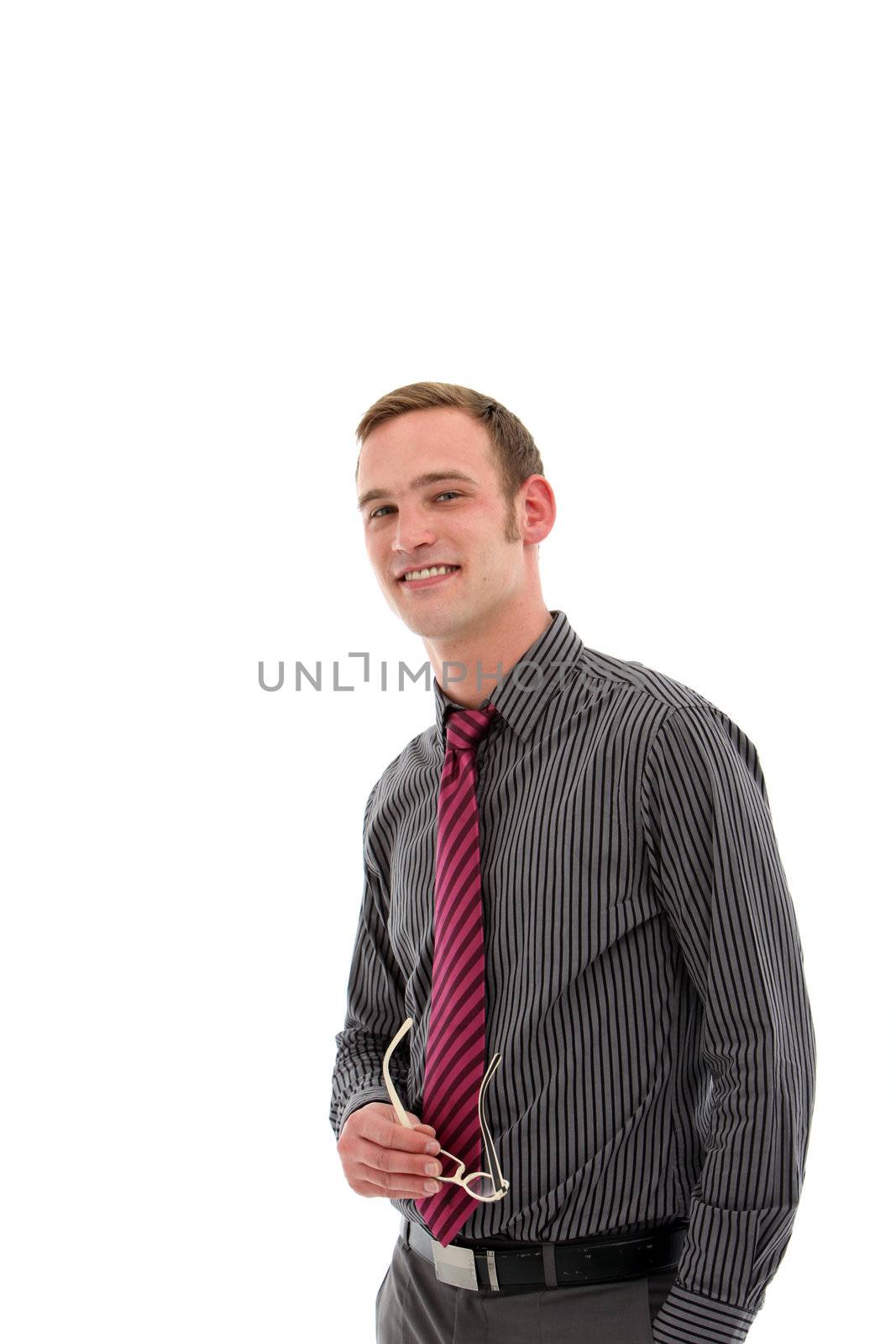 Observant young businessman standing watching and observing his surroundings before making a decision isolated studio portrait.