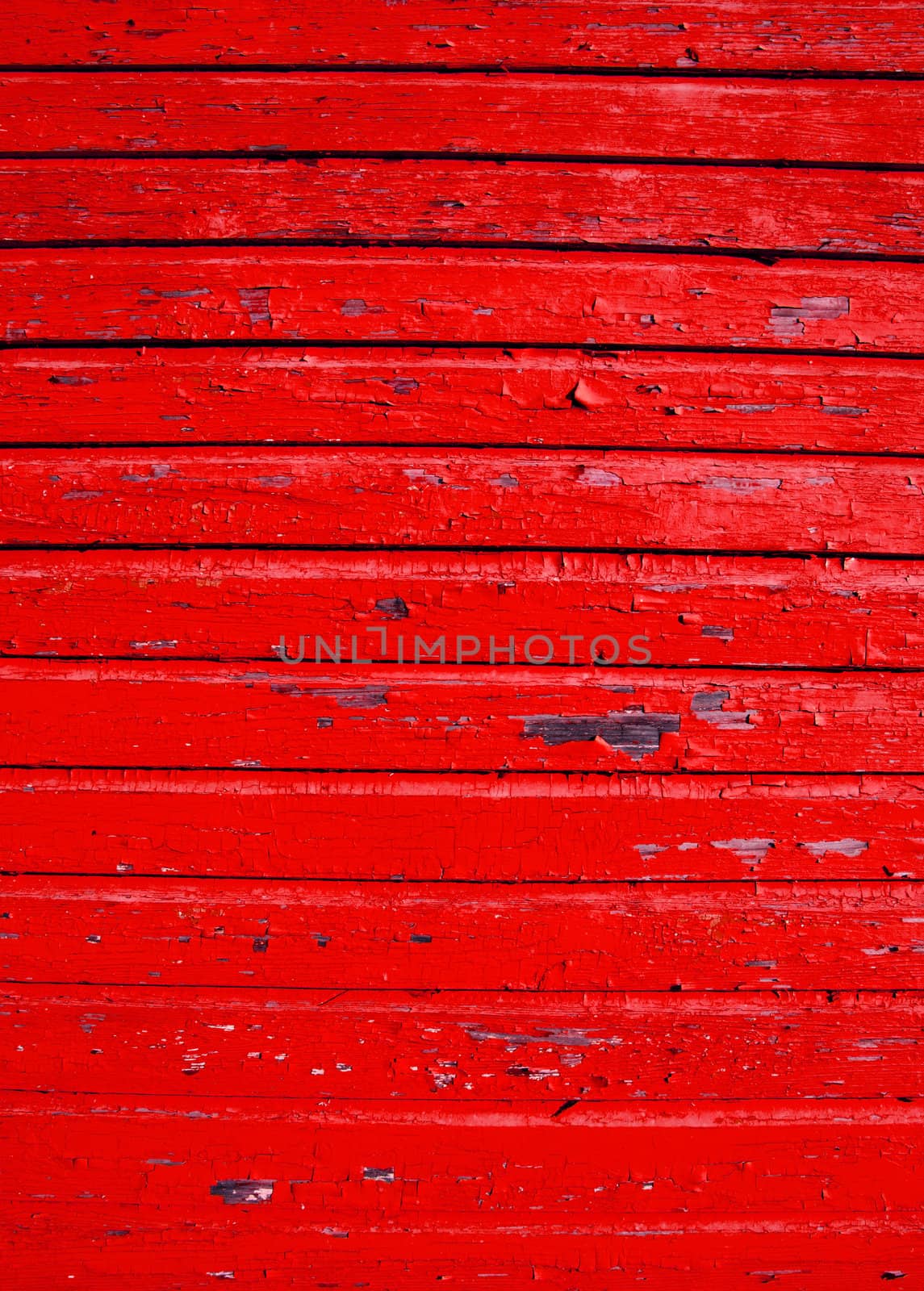 ancient grunge red painted wooden wall with peeling paint background.