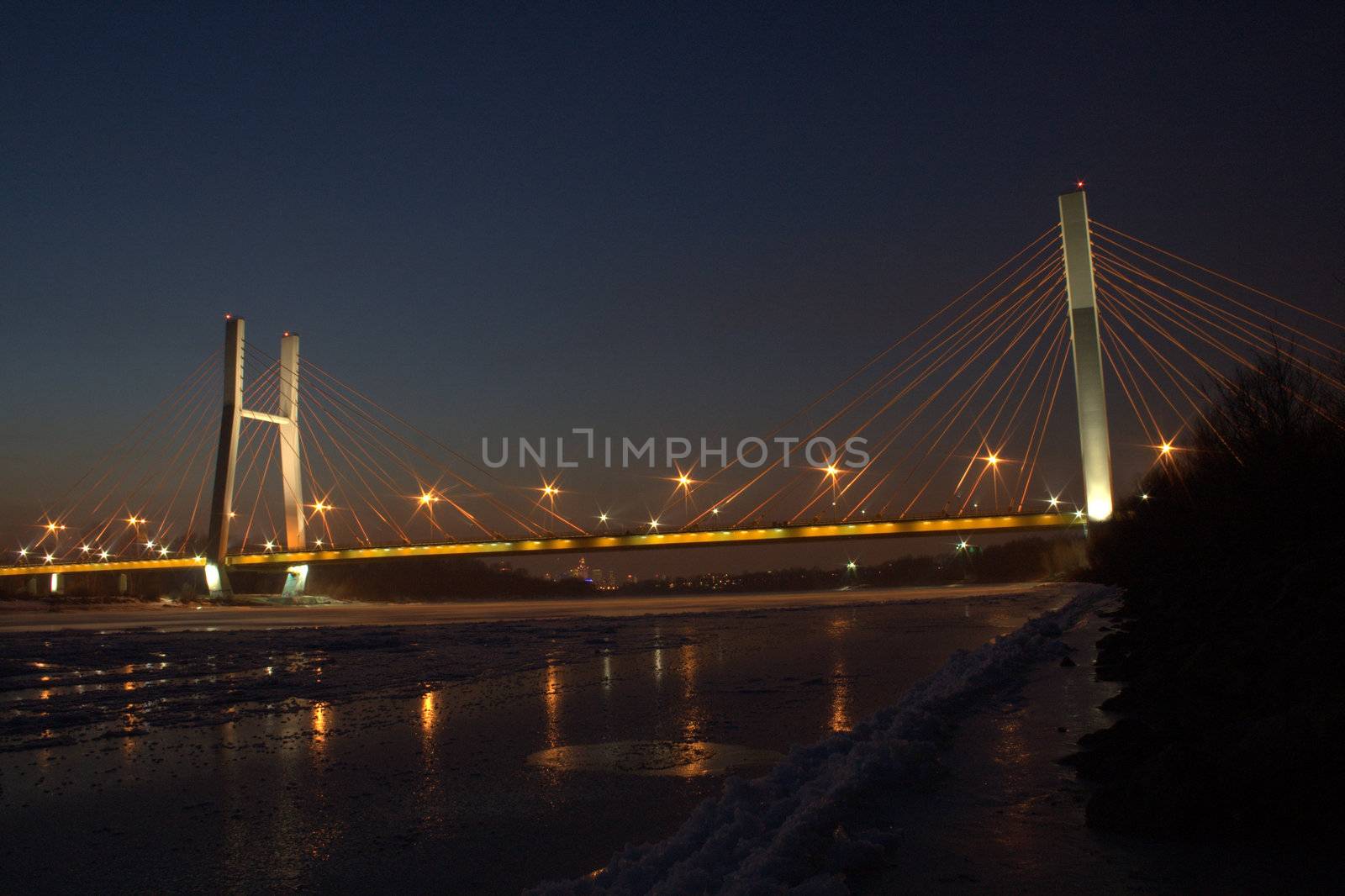 Road bridge in Warsaw, as seen from the Vistula River, late afternoon.