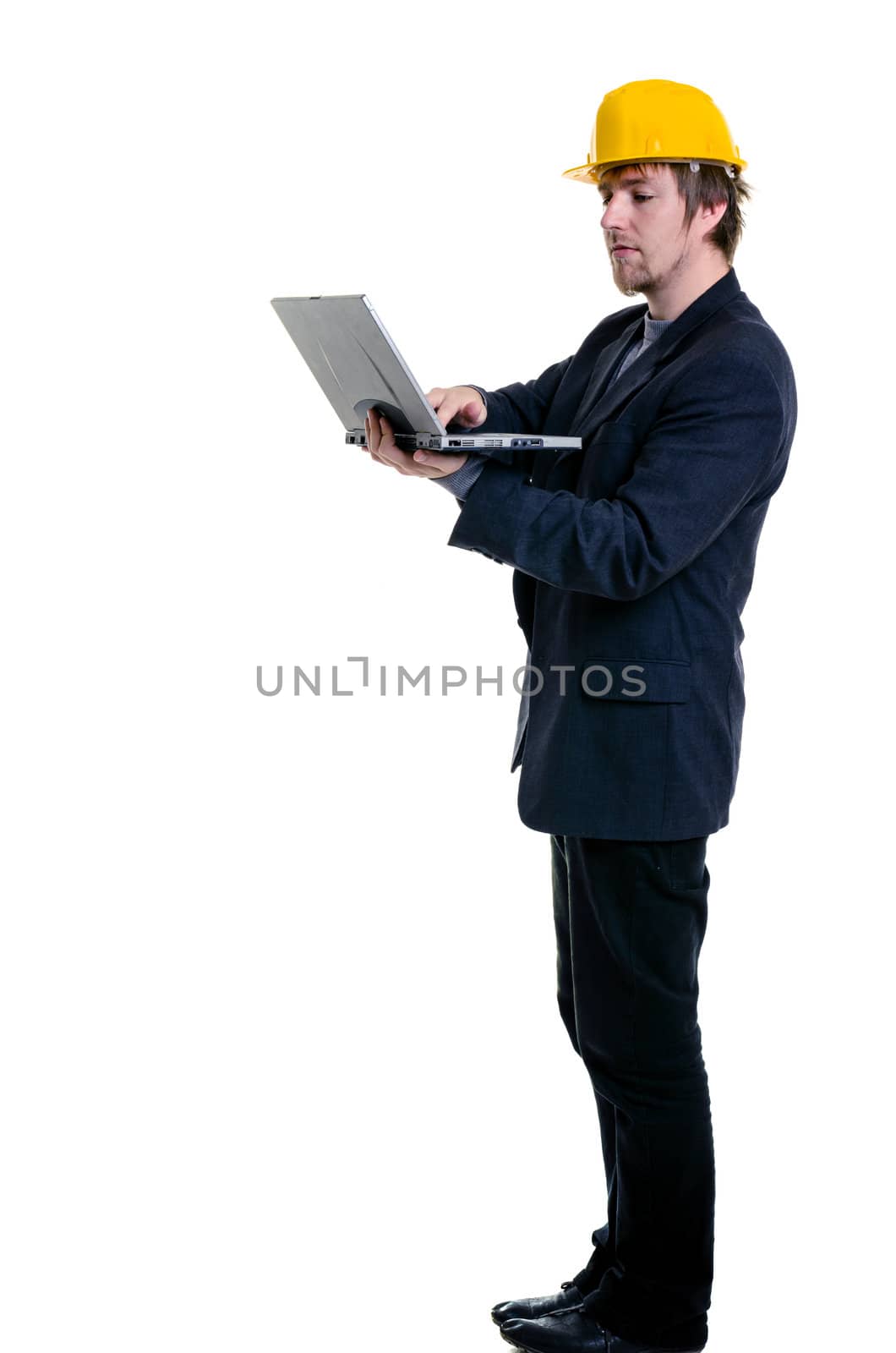 Young man in business suit against white background