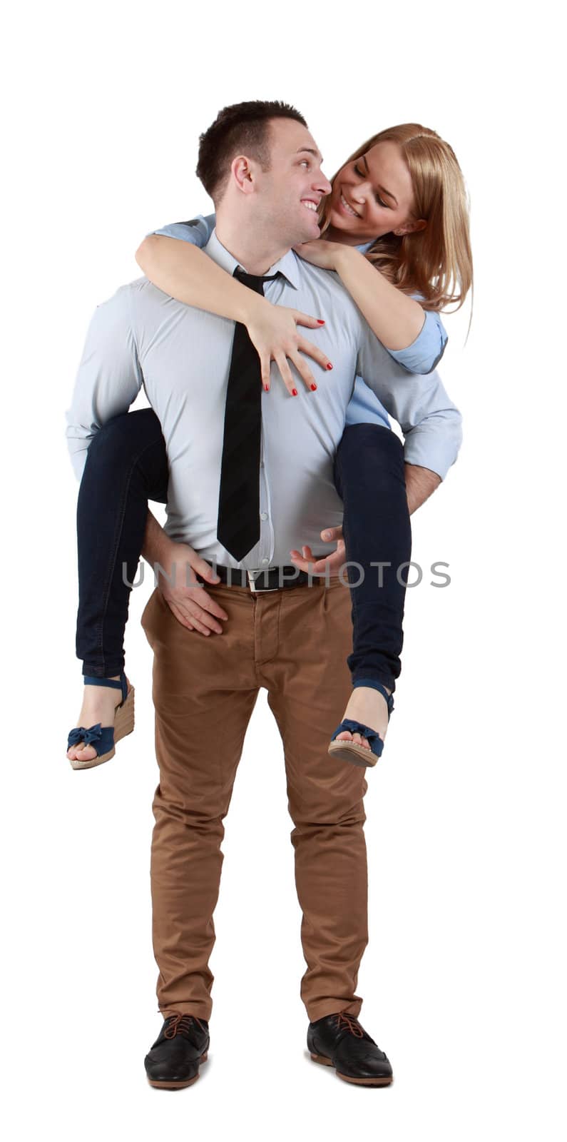 Image of a young couple having fun together against a white background.