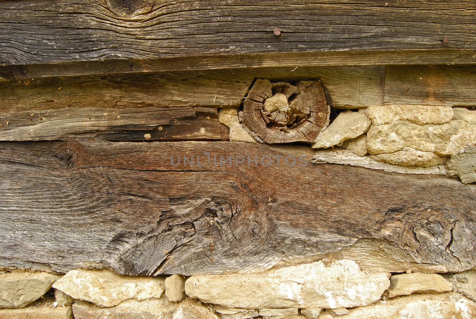 Old village house beams and stones, details close-up