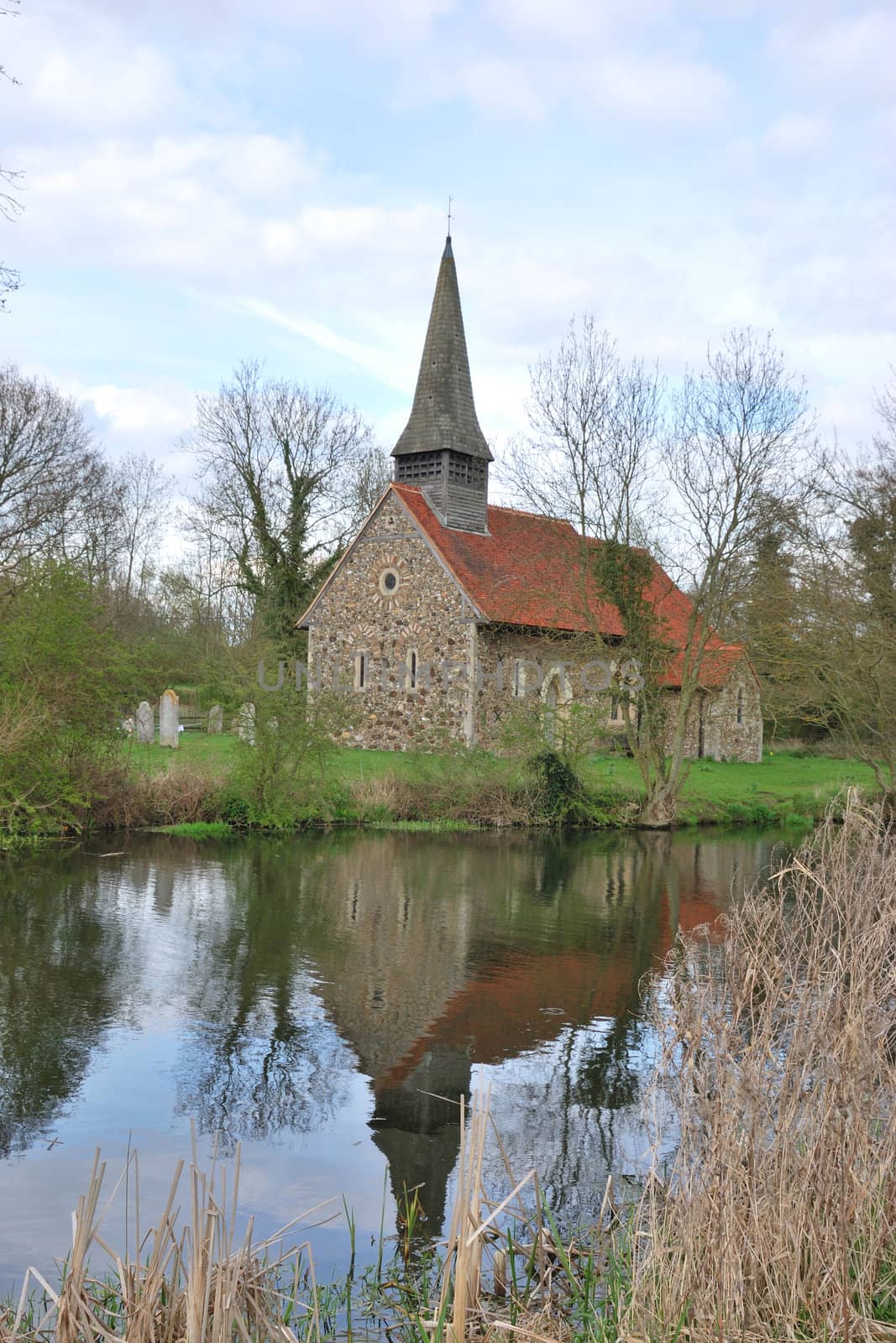 small church reflecting in river