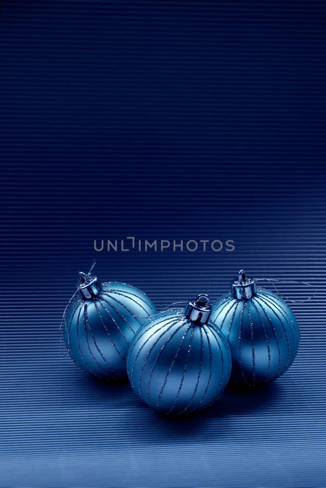 Modern christmas background with glass balls on dark blue background