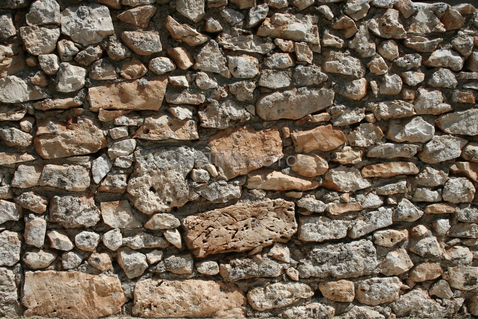 Old rough stone wall construction front view