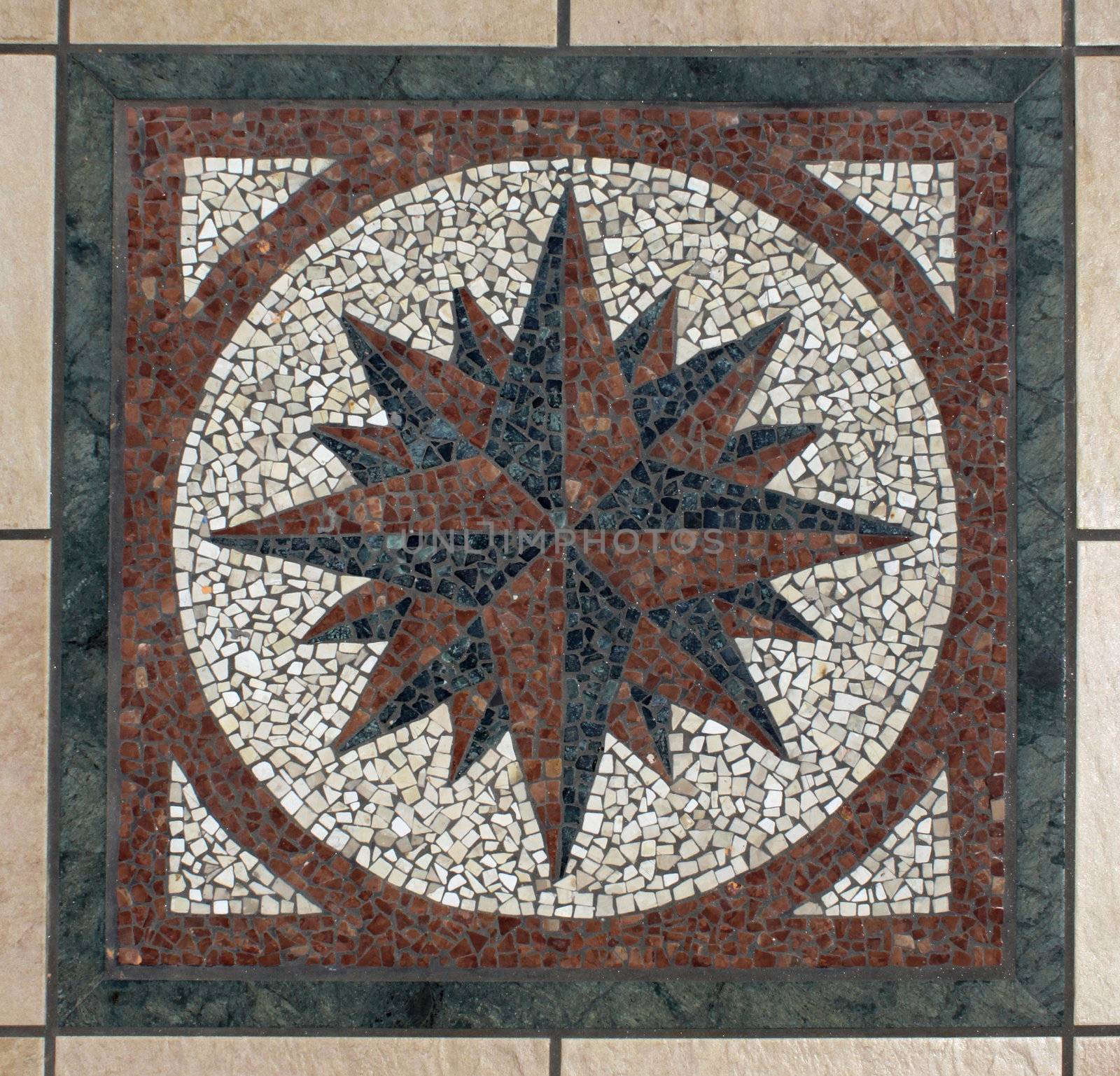 Decorative mosaic compass symbol pattern