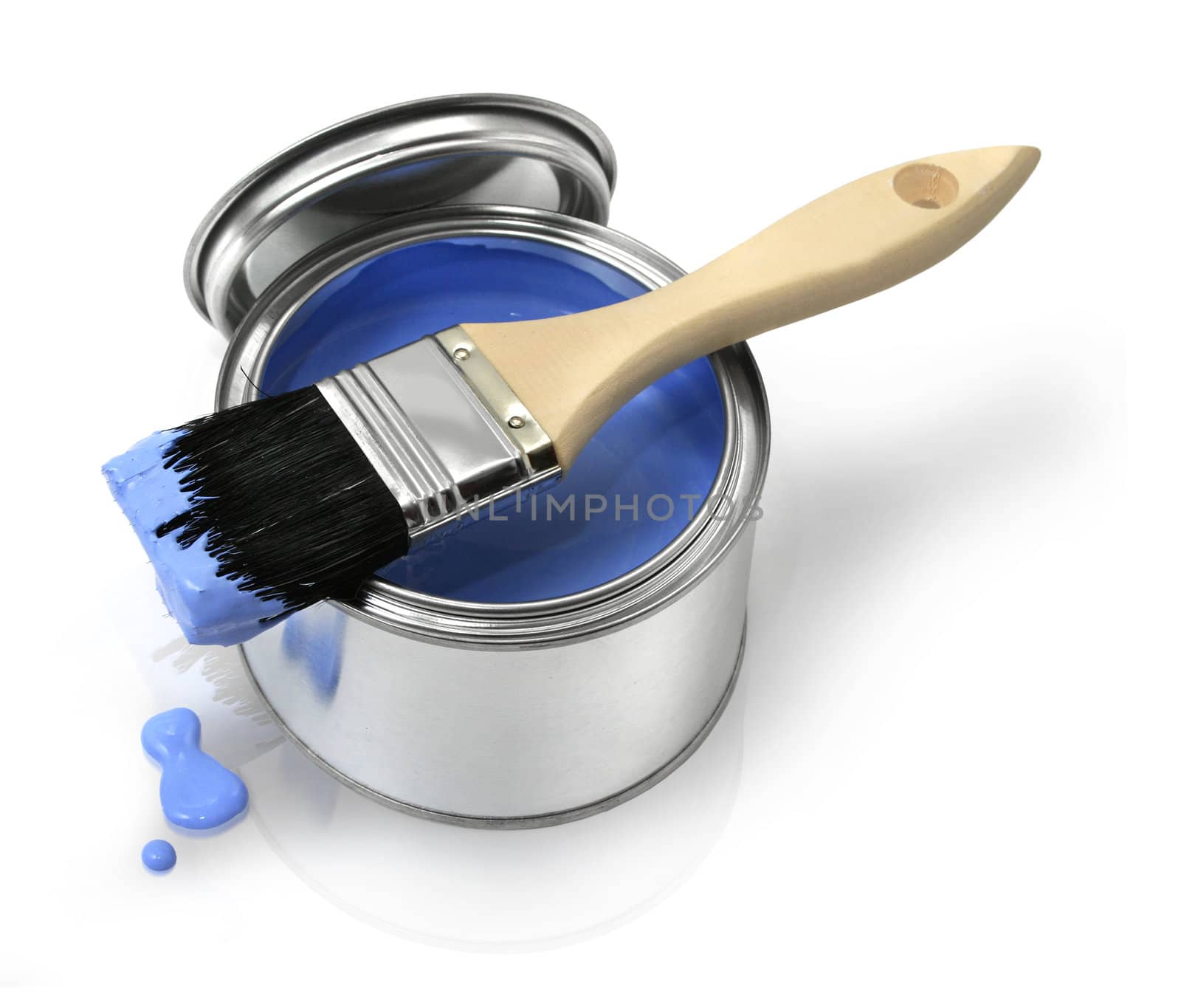 Home improvement paint brush and opened can of blue paint