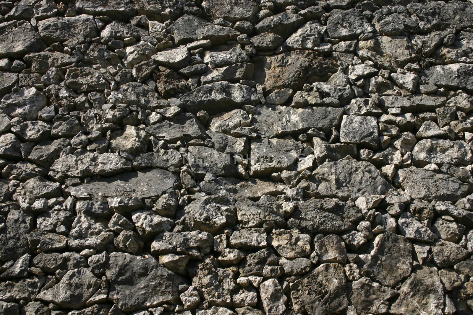 Solid stone wall by anterovium