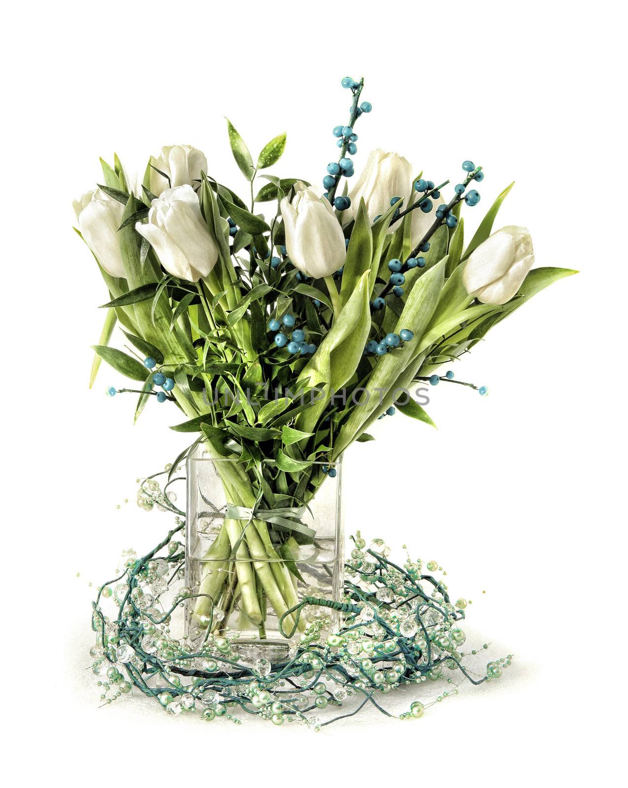Distinguished tulip arrangement in green white and blue, in glass vase