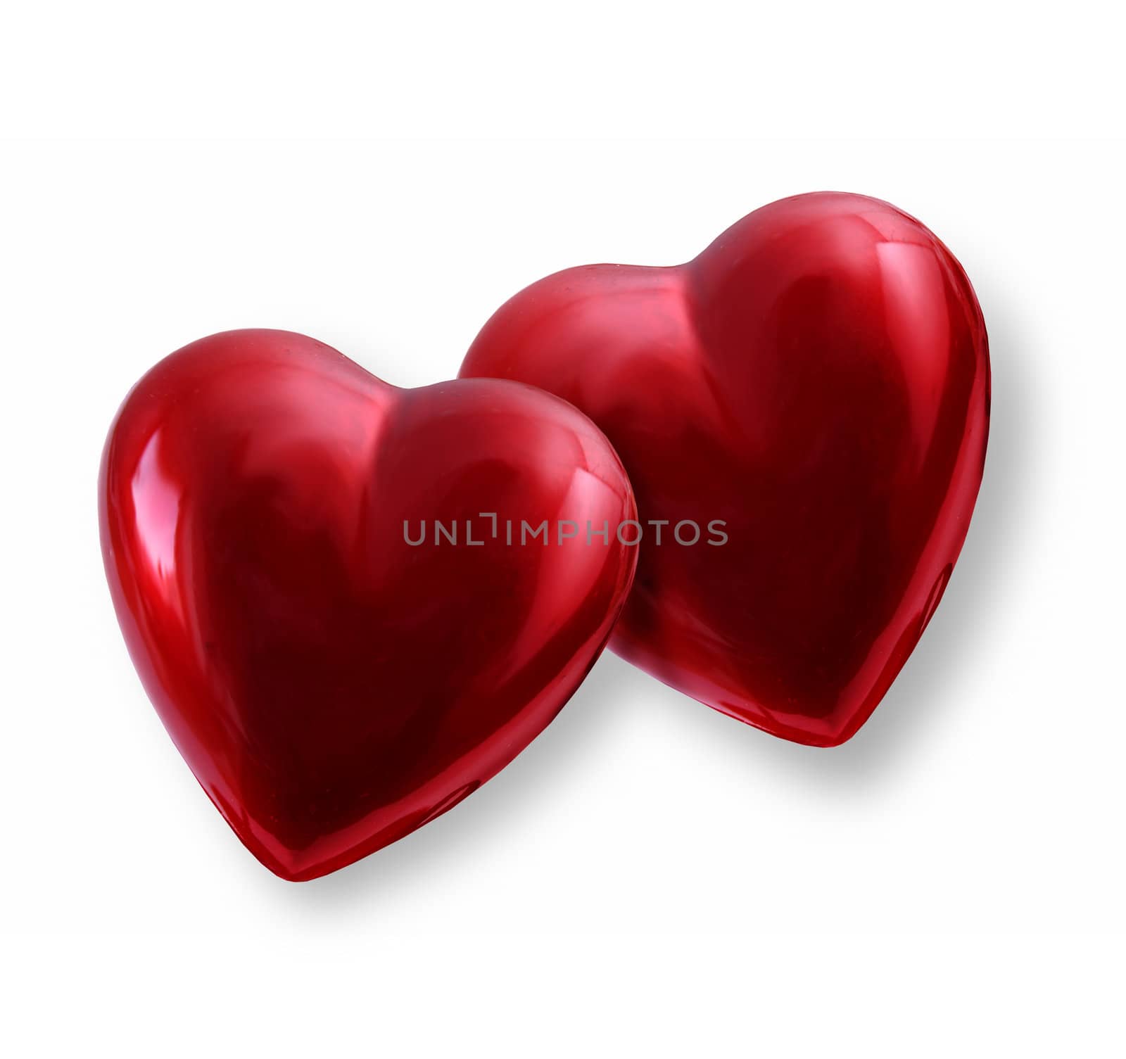 Pair of vivid red shiny Valentine hearts together