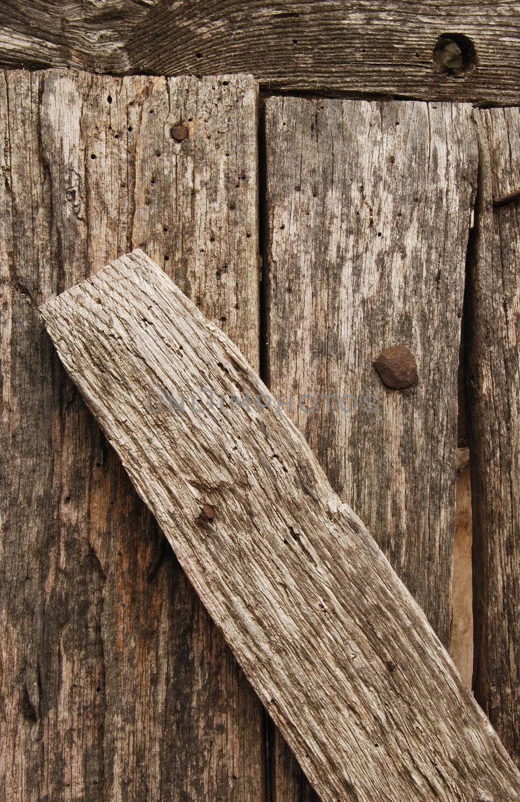 Old wooden nailed boards close-up as background