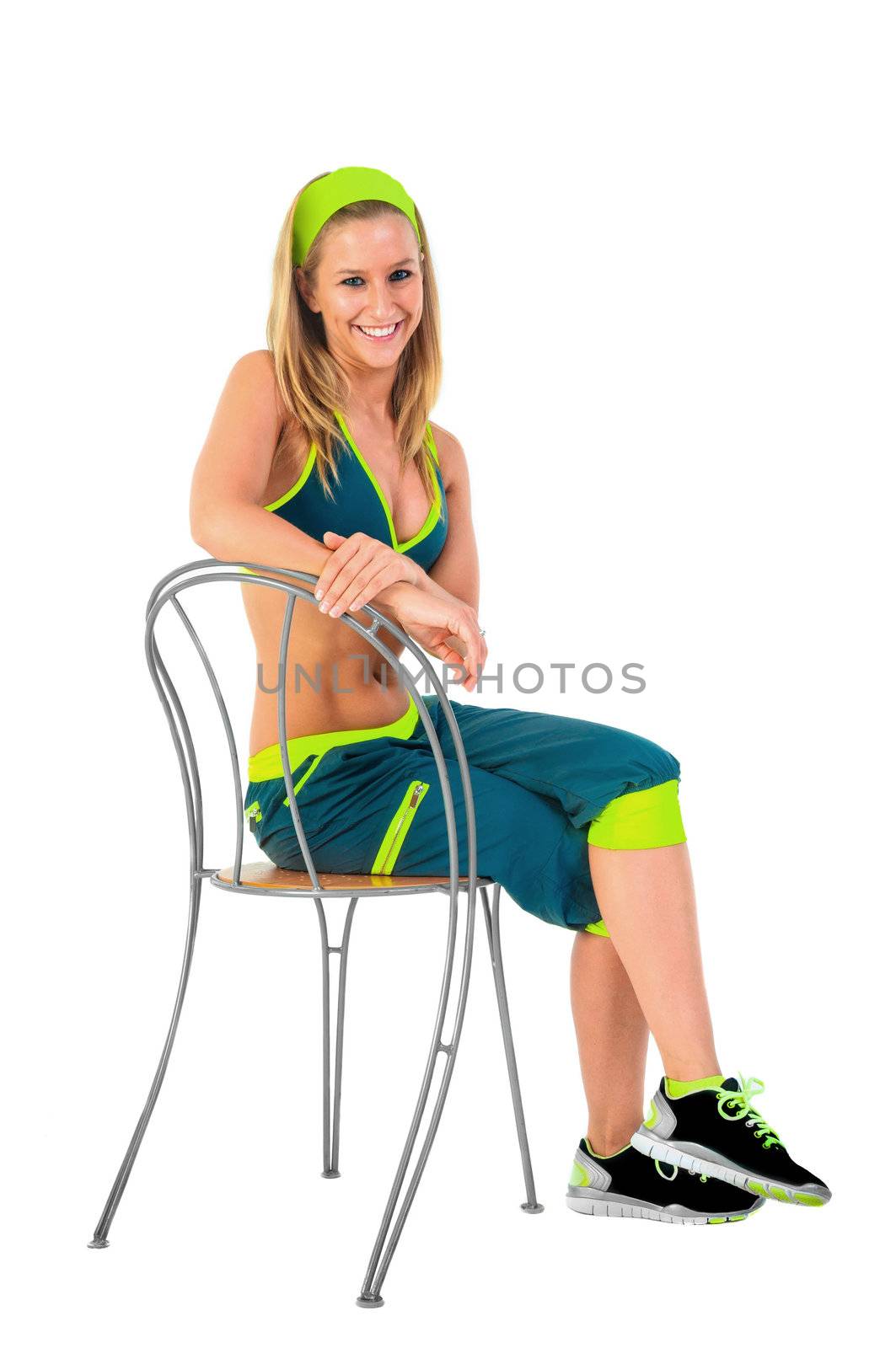 Young fitness instructor sitting on chair