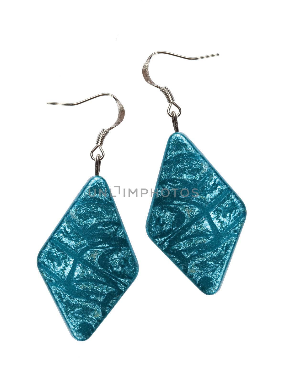 Earrings in silver diamond-shaped blue on a white background. Collage.
