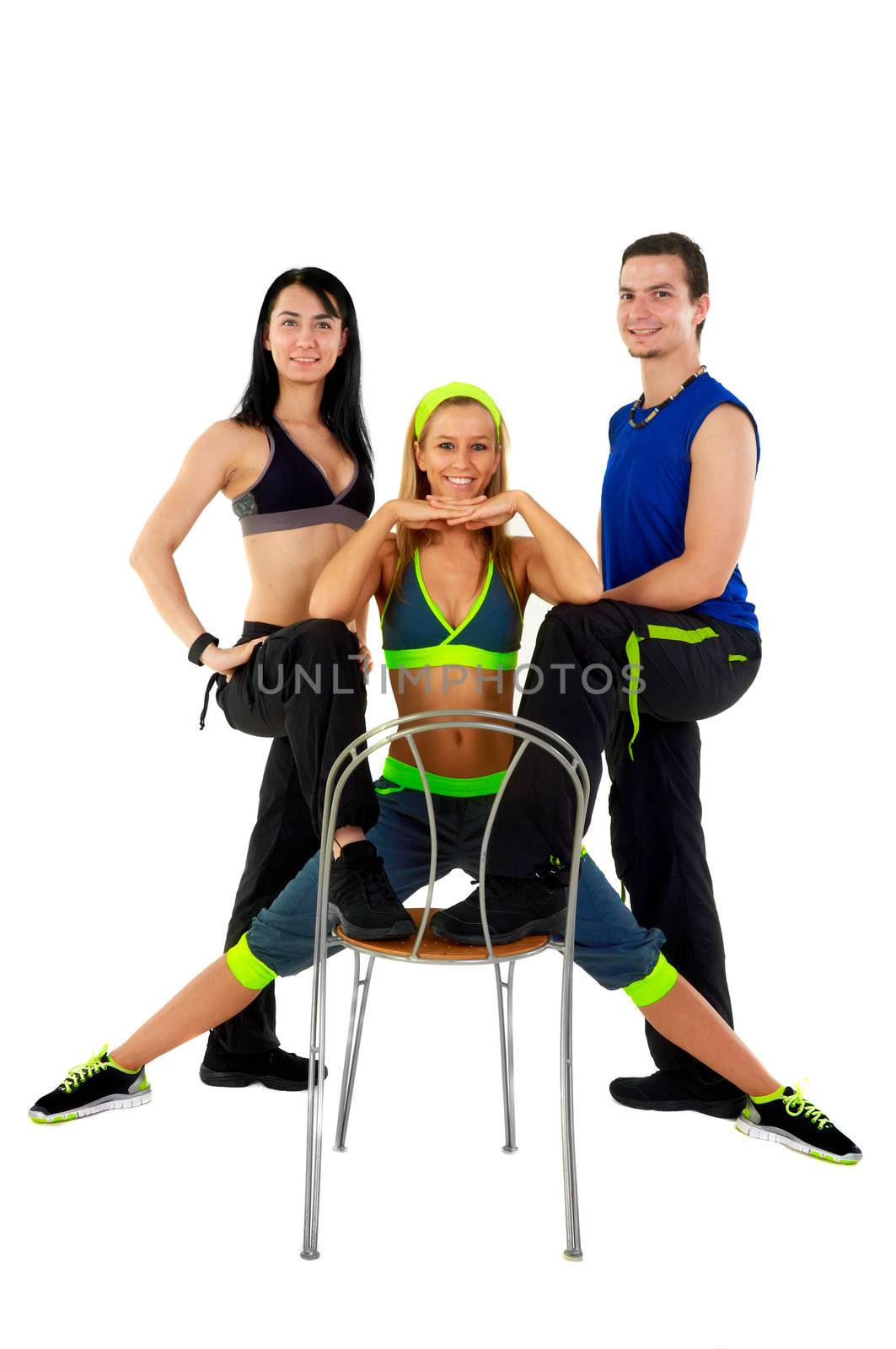 Young fitness instructors against white background