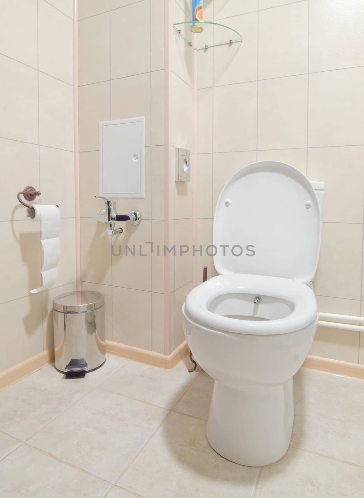 Toilet room interior with white water-closet