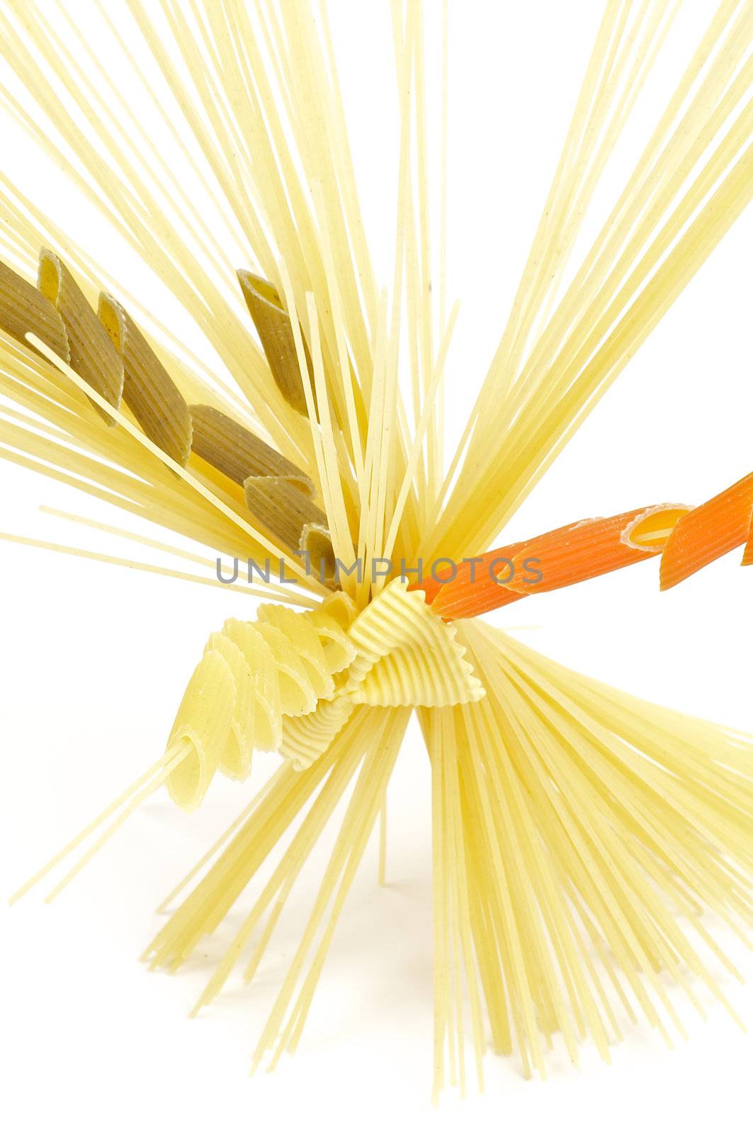 Bunch of spaghetti with color fusilli isolated on white background