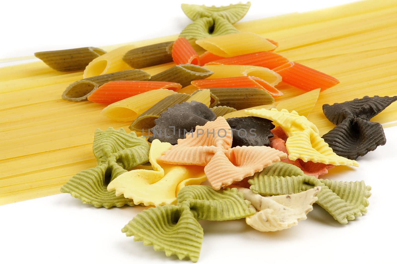 Italian pasta spaghetti, Penne rigate tricolore and farfalle close up