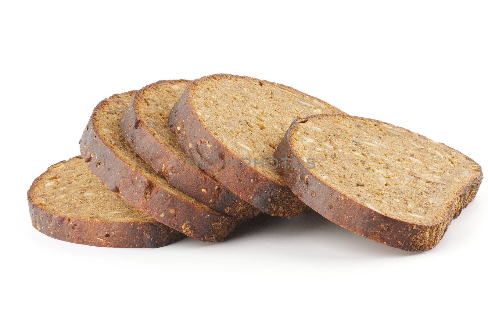 Slices of whole wheat brown bread isolated on white background