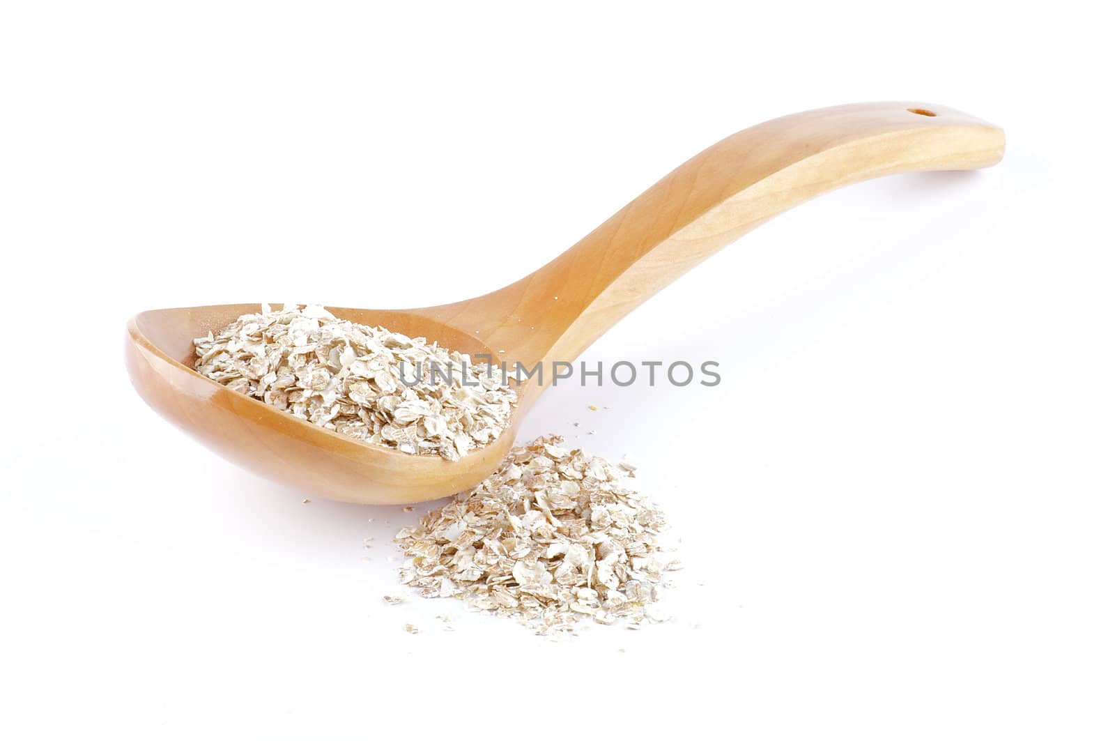 Oat meal cereal mixed in wooden spoon close up on white background
