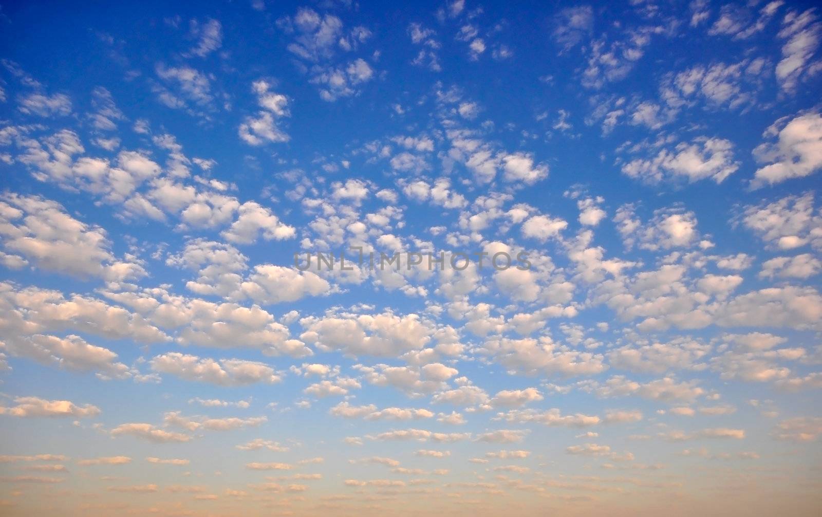 Blue sky with puffy white clouds