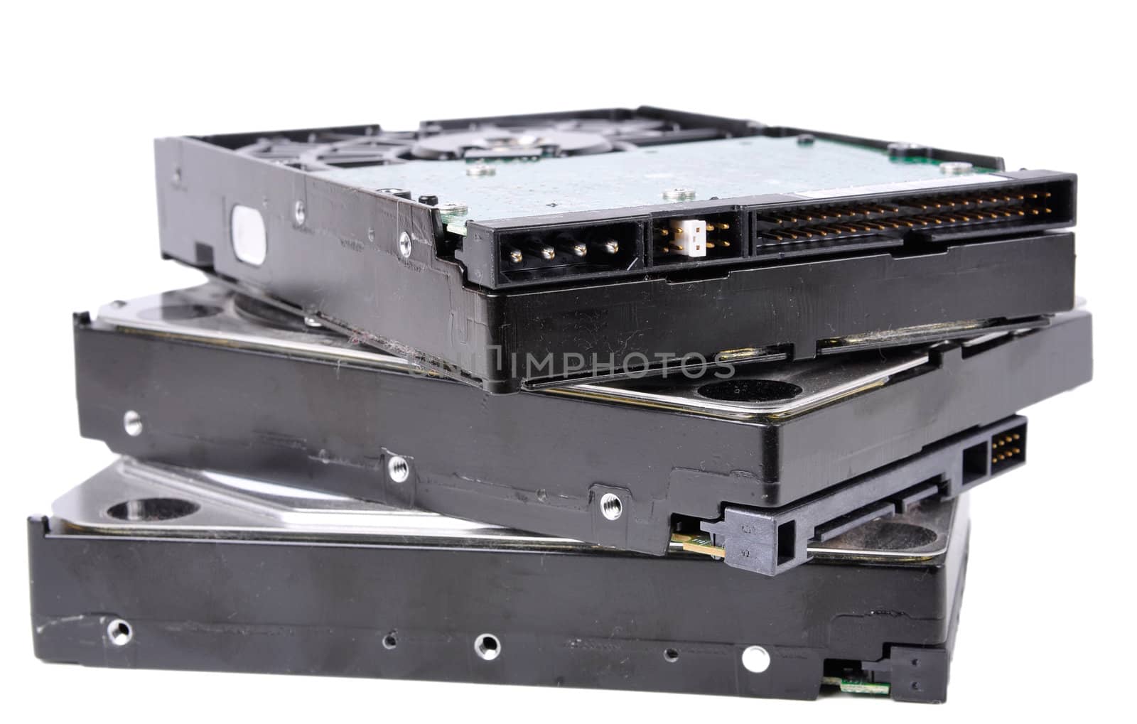 Pile of computer hard drives isolated in a white background