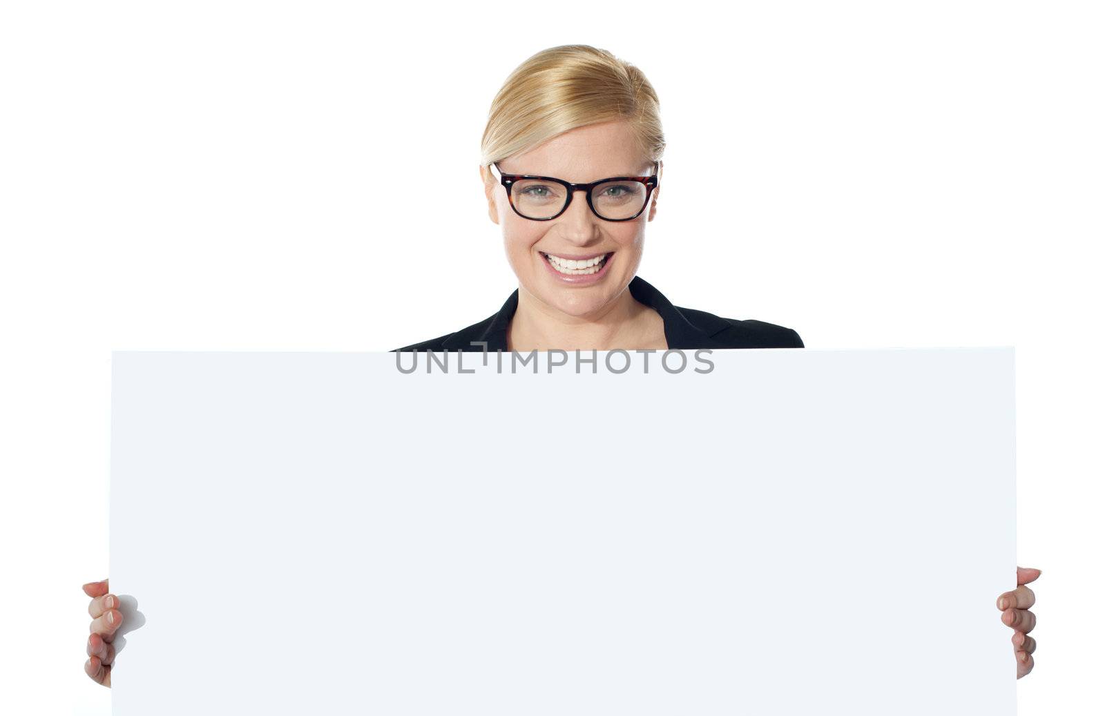 Portrait of happy woman showing blank placard isolated on white background