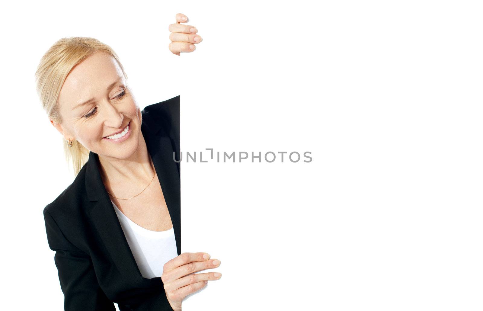 Pretty attractive businesswoman holding blank advertising board