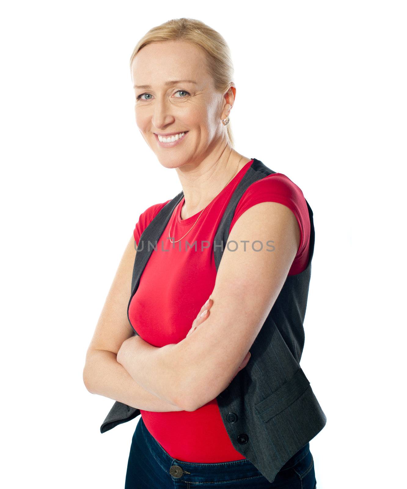 Smiling aged lady with folded arms posing on white background