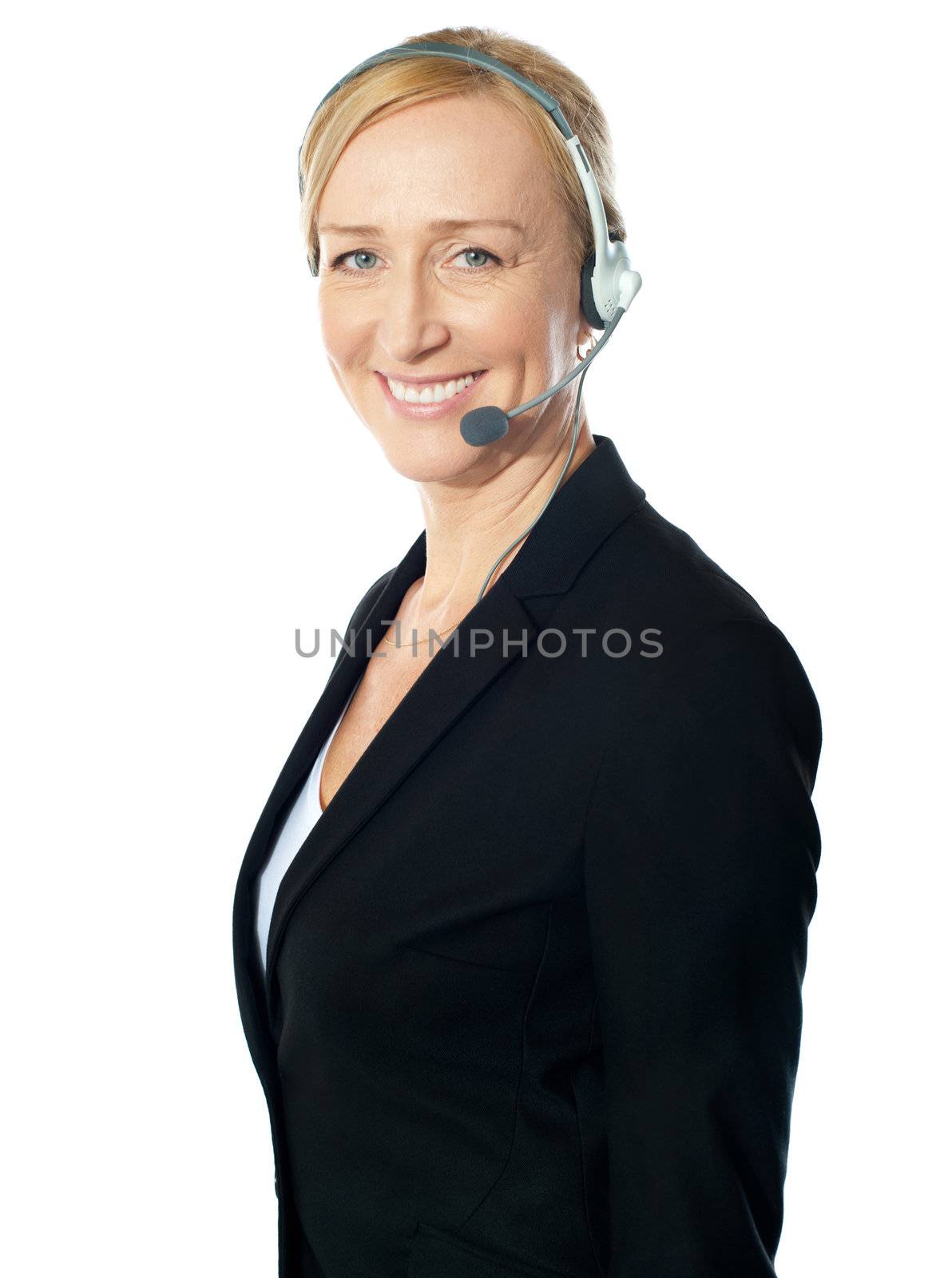 Aged female call centre excutive posing with headsets, smiling