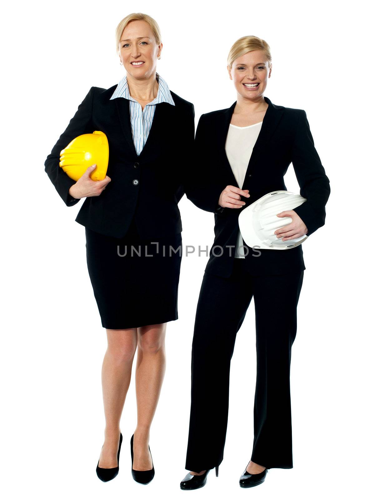 Portrait of two architects with helmets isolated on white background