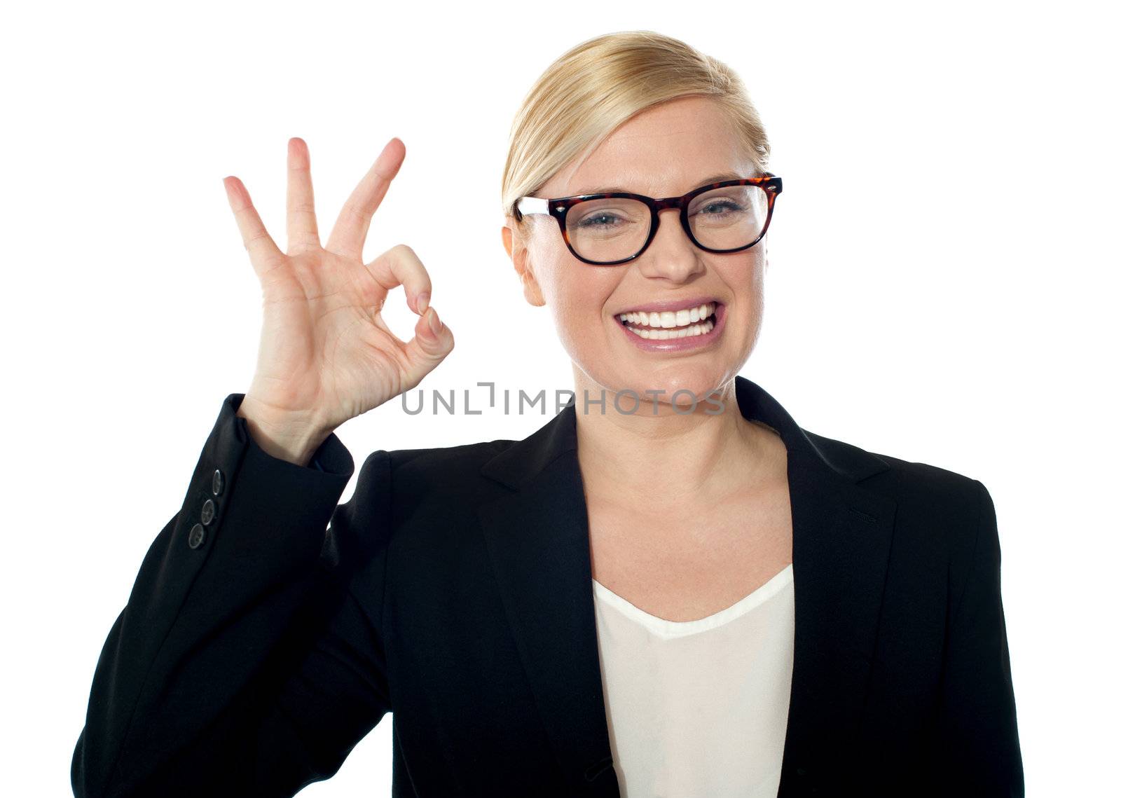 Successful business woman posing with ok sign, isolated over white